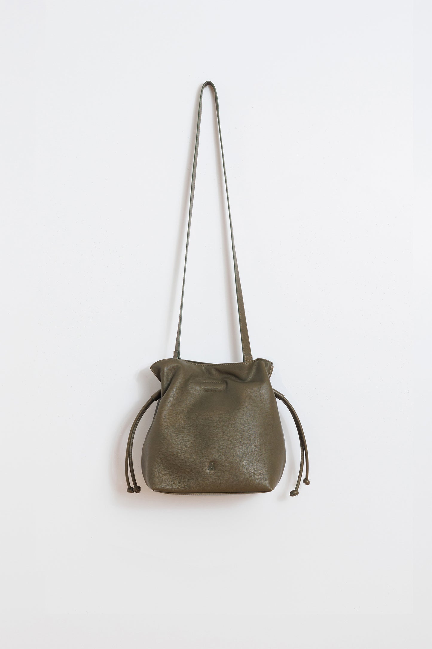 RUCHED-LEATHER SLING BAG