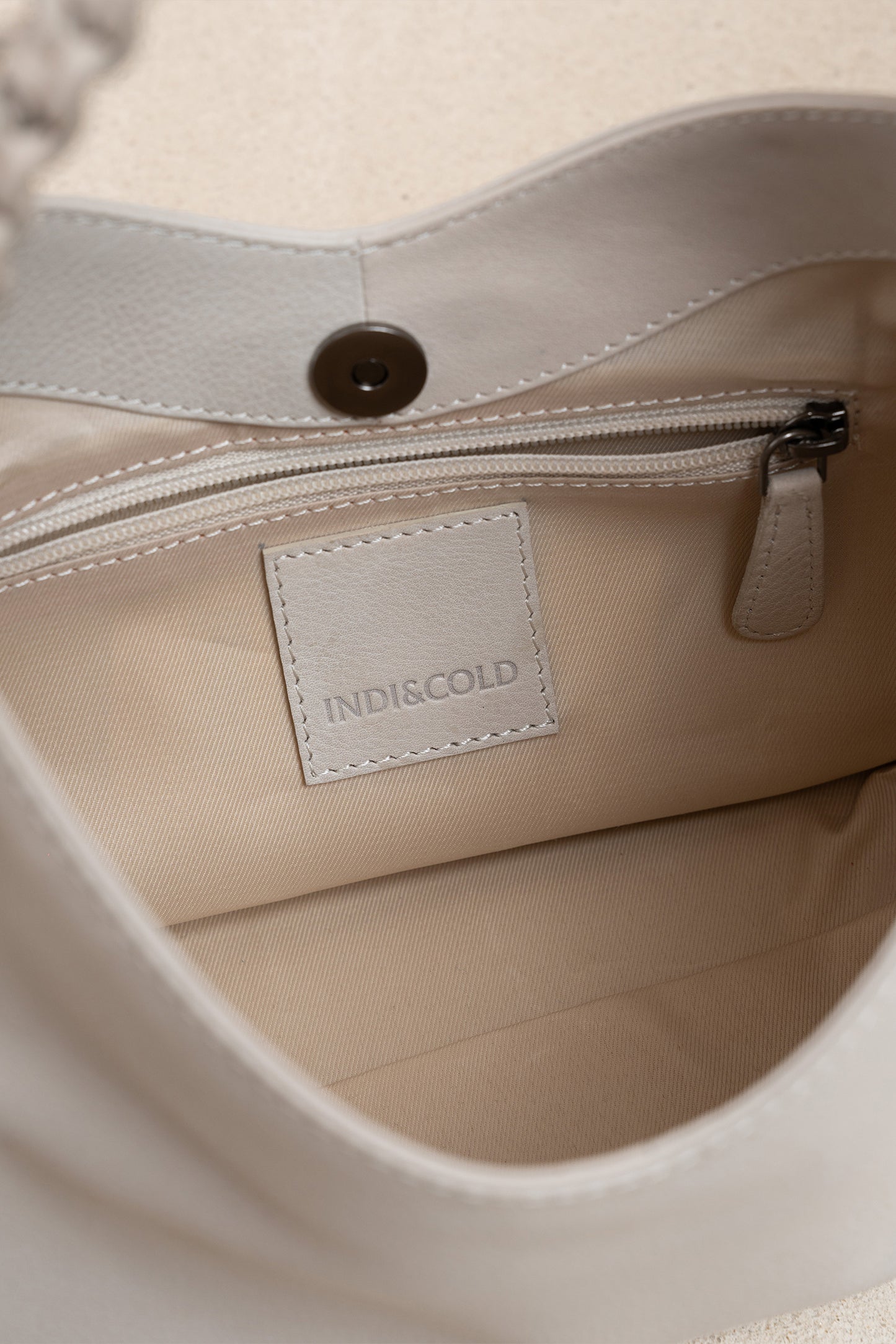LEATHER BAG WITH BRAIDED HANDLE
