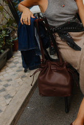 RUCHED-LEATHER SLING BAG