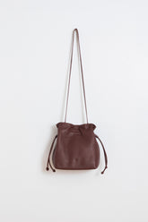 RUCHED-LEATHER SLING BAG