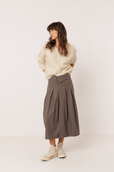 PLEATED CROSSOVER SKIRT