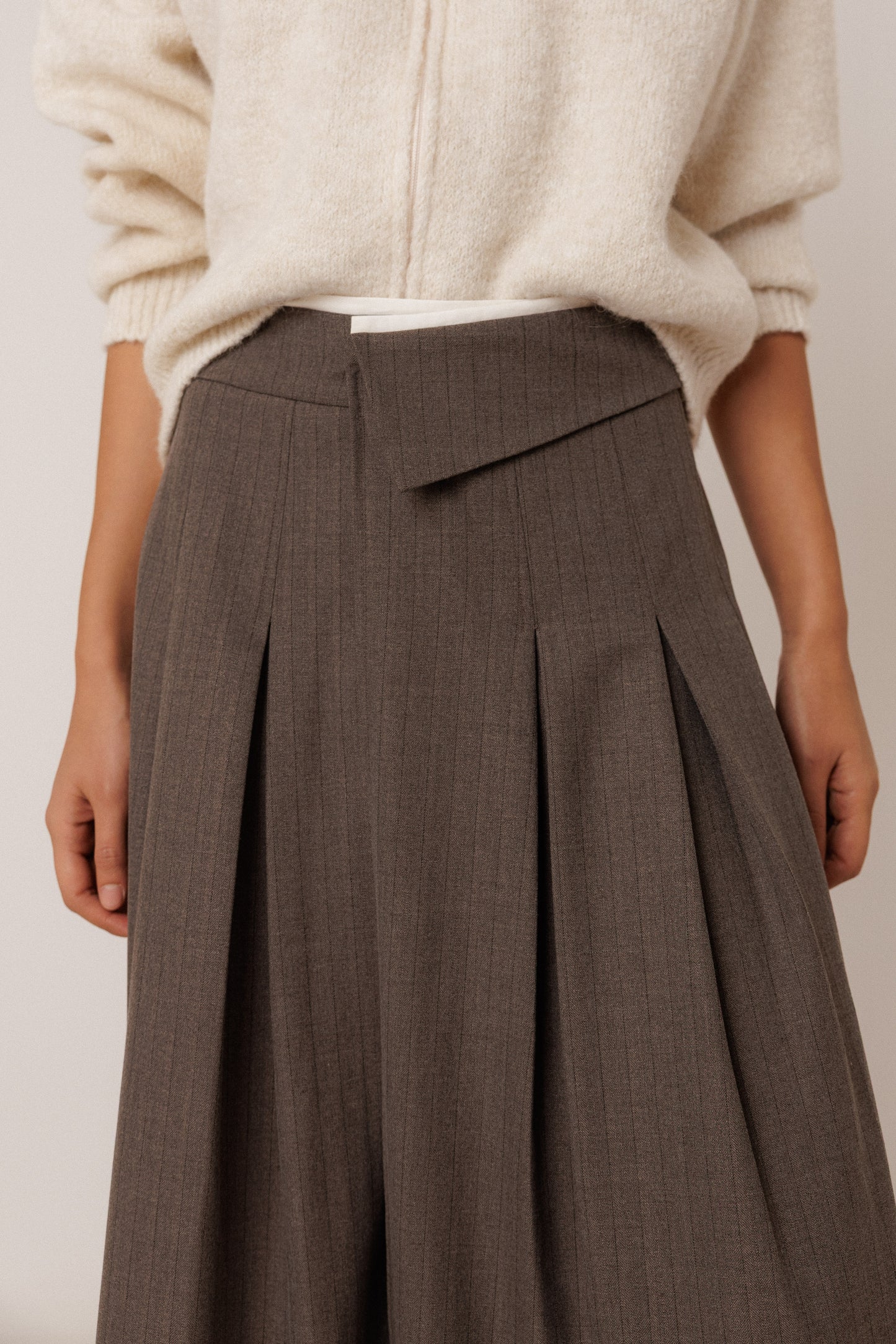 PLEATED CROSSOVER SKIRT
